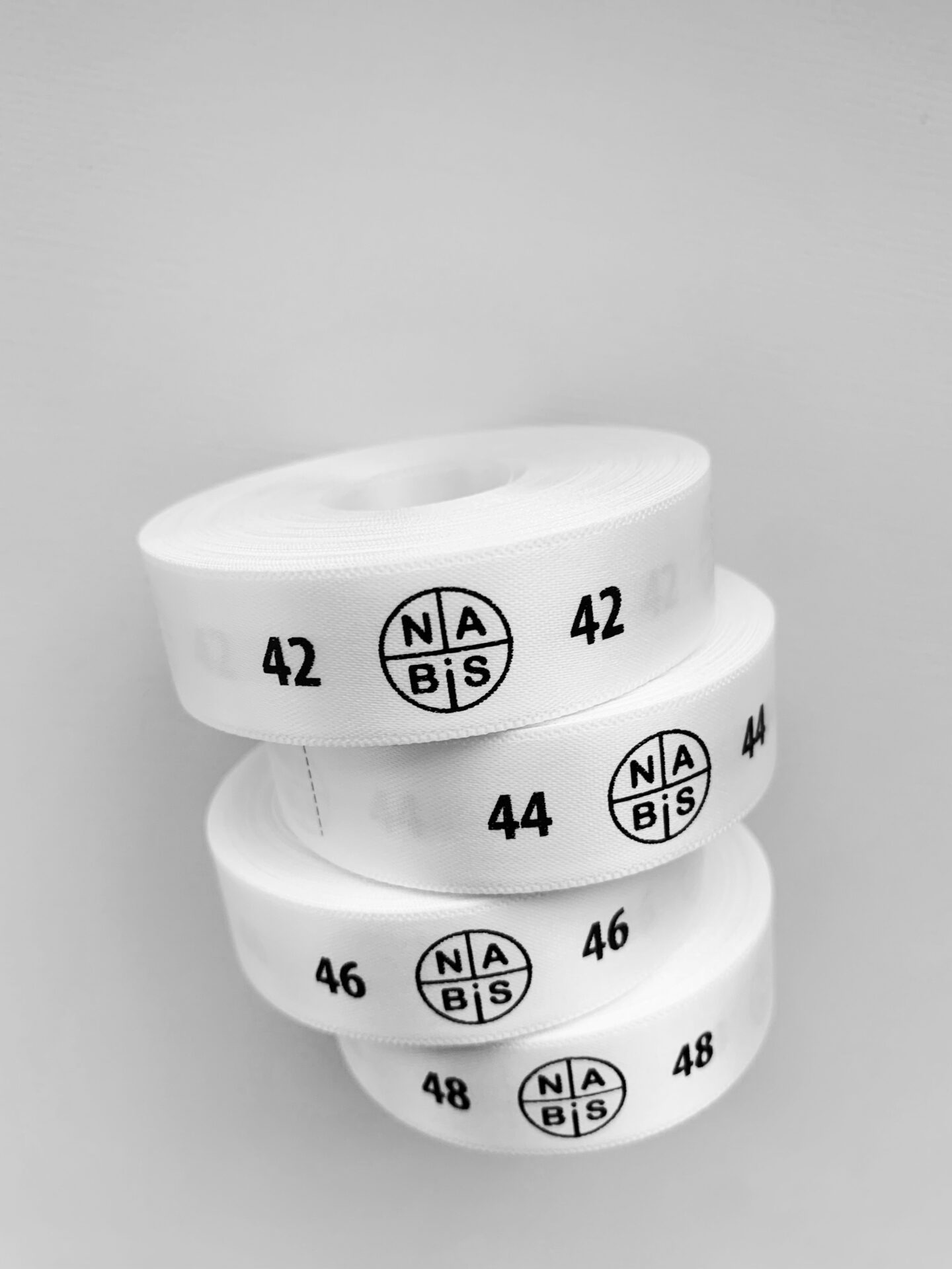 Печать размерников для одежды на заказ из сатина, силикона и нейлона